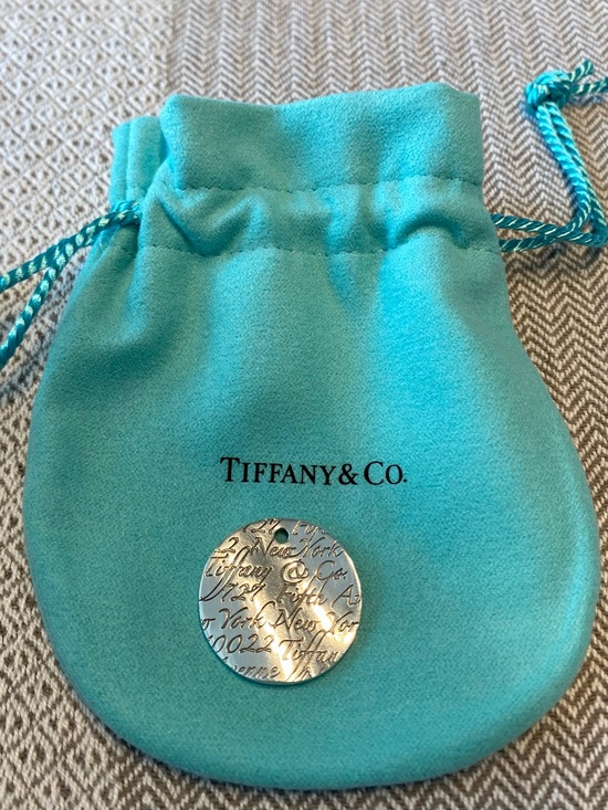 Tiffany & Co. Jewelry - Tiffany & Co. Silver Engraved Round Tag “Notes” Pendant with Signature Pouch